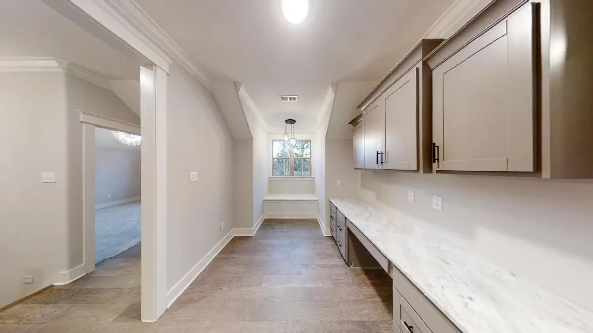 Custom pantry featuring modern style in custom home building.