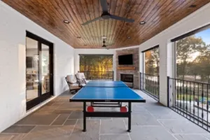 Covered outdoor Kitchen and ping pong table.