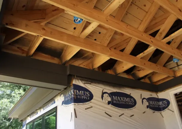 Framing the home roof support during construction.