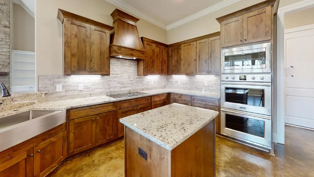 Kitchen with custom wall and centered island countertop.