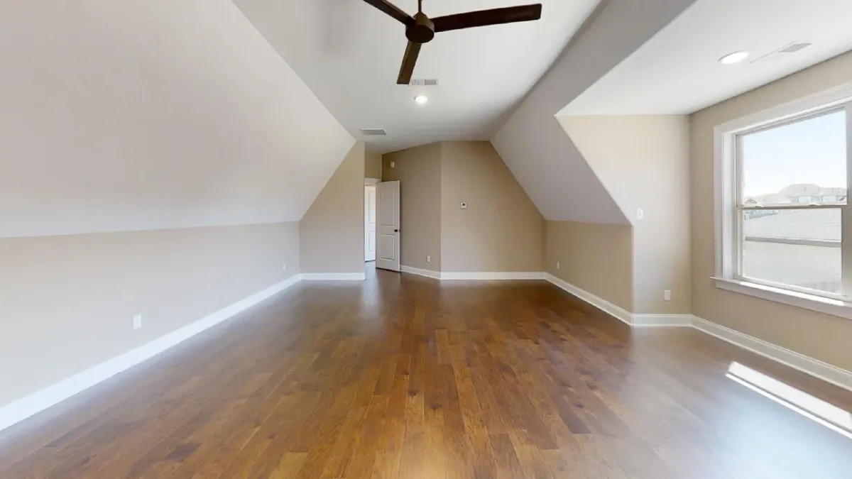 Bedroom or gameroom finished with hardwood floor.