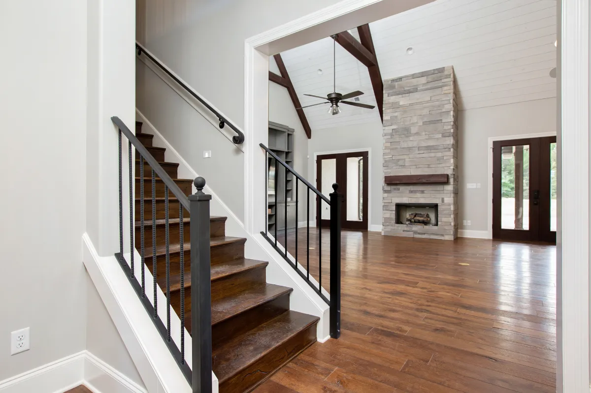 Entryway showing wood stairs.